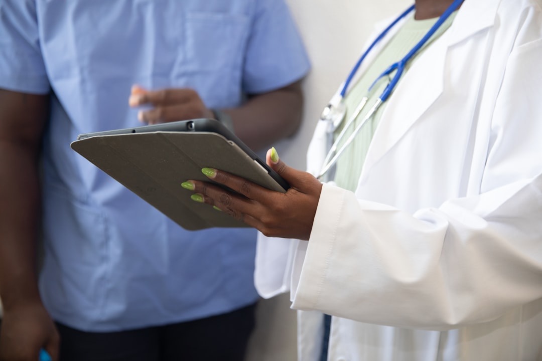 a-doctor-showing-a-patient-something-on-the-tablet-j5utvrgse7q